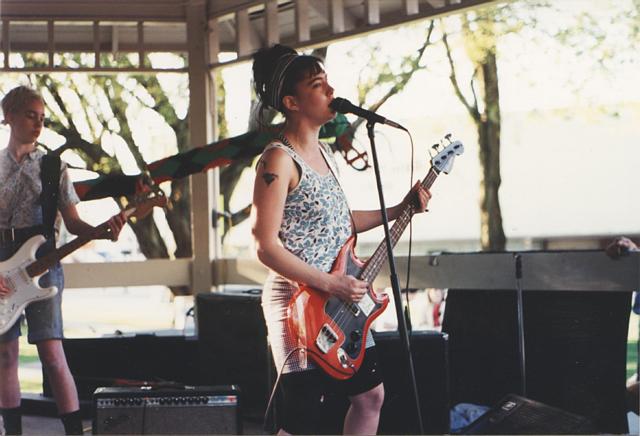 Bikini Kill performing onstage in Washington